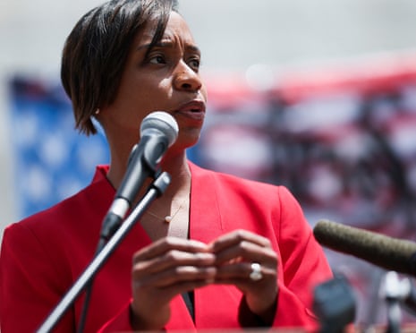 a woman speaks into a microphone