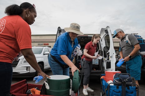 Volunteers pack carts with ice, towels and water to give to people struggling in the extreme heat.