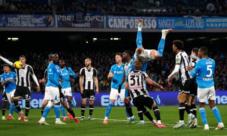 Scott McTominay prepares to hit the turf after connecting with the header that gave Napoli the lead against Udinese.