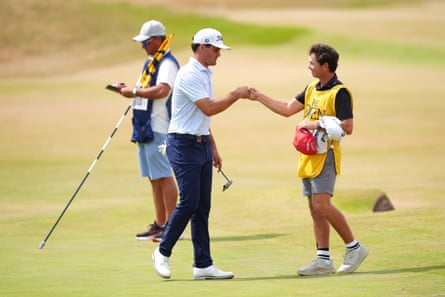 Jackson Suber fist-bumps his caddy aft his 2nd round