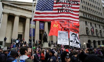 Demonstrators protest against tax cuts next to the New York Stock Exchange on Saturday.