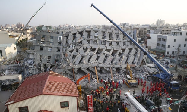 Rescuers search for dozens missing in the collapsed apartment building in Tainan on Sunday. Photograph: Wally Santana/AP 