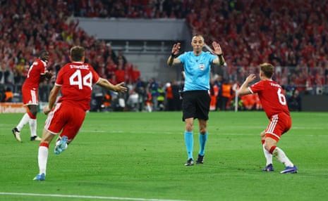 Josip Stanisic and Joshua Kimmich remonstrate with referee Joao Pinheiro after a very controversial (non) penalty decision.