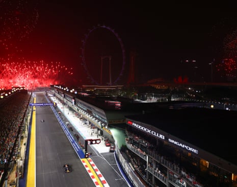 Fireworks go off as Race winner Max Verstappen takes the chequered flag.