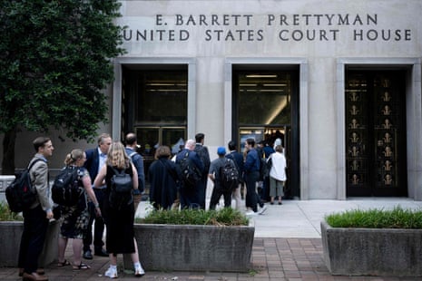 People wait to enter court for hearing at the E. Barrett Prettyman US Courthouse in Washington, DC.