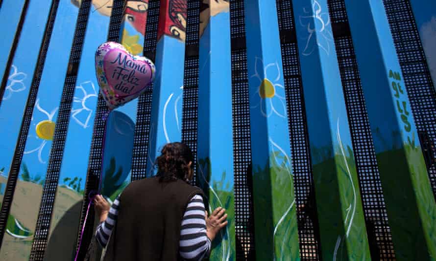 A woman talks with her daughter through the border fence at Friendship Park, 10 May 2015.