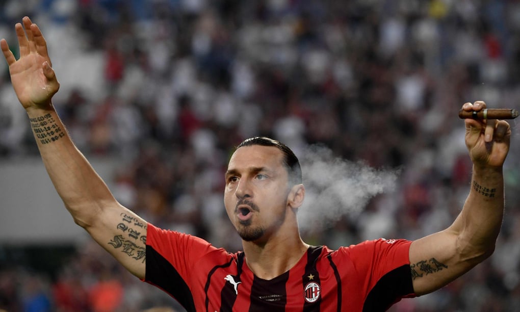 He shoots, he self-mythologises: Zlatan Ibrahimović smokes a cigar during the trophy ceremony after AC Milan won Serie A in May