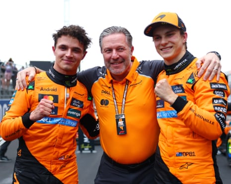 McLaren CEO Zak Brown (centre) with Oscar Piastri (right) and Lando Norris after their 1-2 in Shanghai.