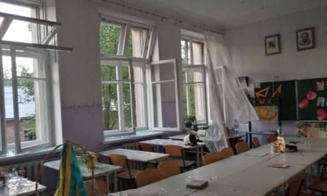 An interior view shows a school classroom damaged by a Russian military strike in a location given as Marhanets.