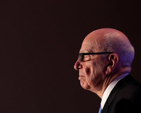 Rupert Murdoch in profile against a dark background, wearing glasses and a suit