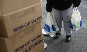 An FDA contract worker collects food and supplies from a food pantry for furloughed workers during the government shutdown, which ended last week.
