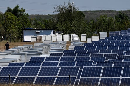 A man walks through a photovoltaic park in Cienfuegos, Cuba, 20 March 2025