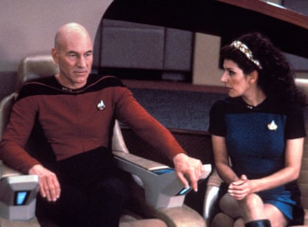 The actors sit side by side in Star Trek: The Next Generation.