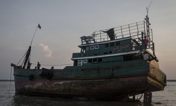 A boat which carried Rohingya and Bangladeshi migrants sits abandoned in Kuta Binje, Aceh, Indonesia, on Wednesday. 