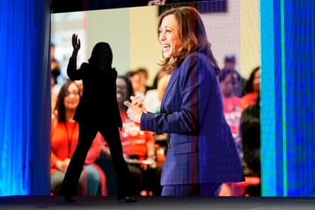 woman’s silhouette against a screen with her image on it