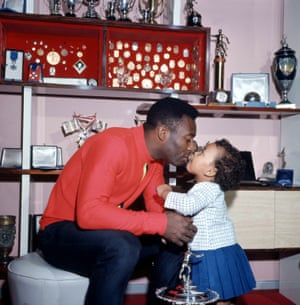 Pelé receives a kiss from his daughter Kelly Christina