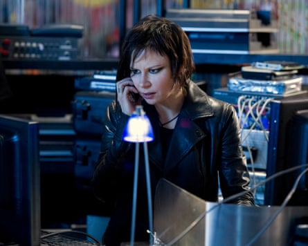 Woman on telephone looks at screen