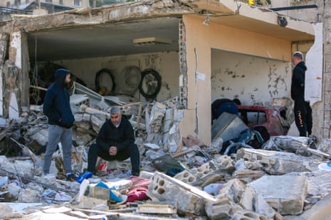 Men check the rubble of a building in Bint Jbeil in southern Lebanon after an Israeli bombardment.