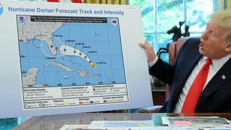 Donald Trump displays Hurricane Dorian map apparently doctored with marker pen – video