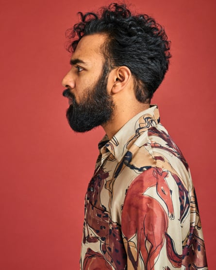Himesh Patel in profile in a brightly coloured patterned shirt