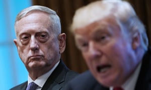 Donald Trump speaks as the former defense secretary James Mattis looks on in 2017.