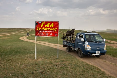 A red roadside sign