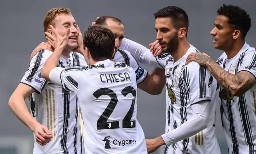 Dejan Kulusevski (left) is mobbed by his Juventus teammates after opening the scoring.