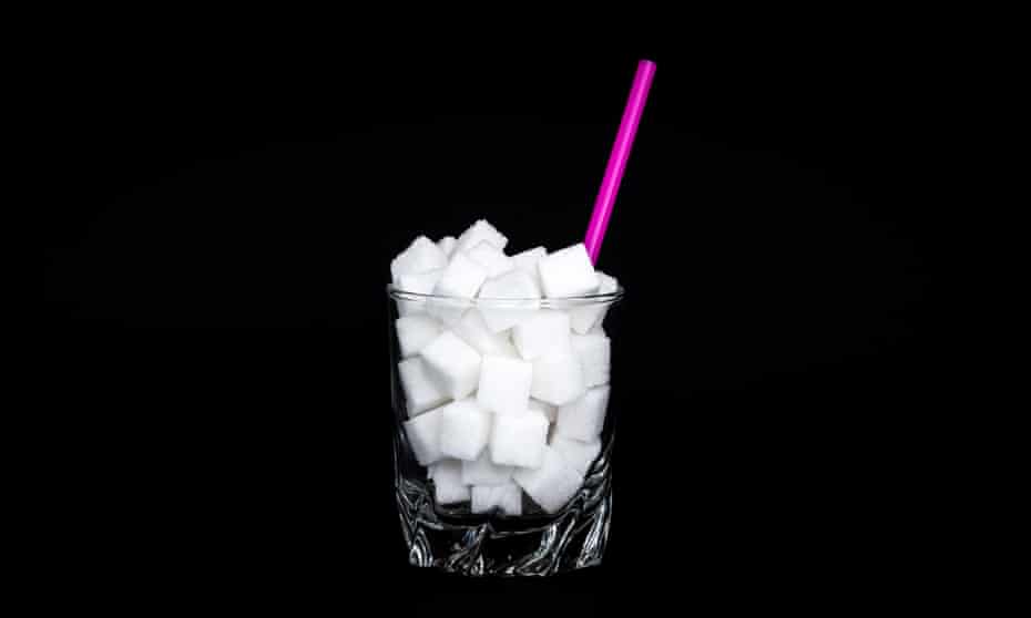 Glass filled up with sugar cubes
