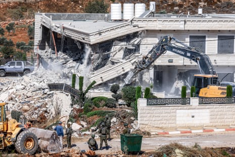 The building in Qalandia, south of Ramallah, is demolished by Israeli authorities in the occupied West Bank.