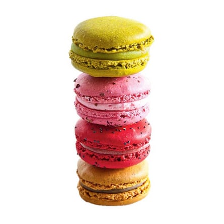 a pile of four multicoloured macarons
