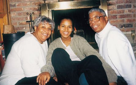 Kerry Washington sitting in front of a fireplace with her parents, Valerie and Earl, in 1998.