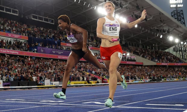 Jessie Knight of England crosses the line fractionally ahead of Canada’s Kyra Constantine to win the 4x400m relay