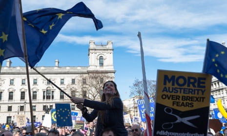 A young woman waves an EU flag at the Unite for Europe rally in Parliament Square on 25 March