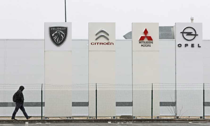 Boards with logos of Peugeot, Citroen, Mitsubishi Motors and Opel at the PCMA Rus car plant outside Kaluga in March.