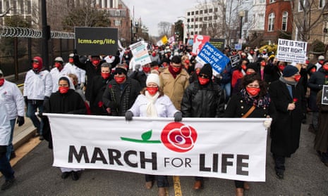Anti-abortion activists participate in the annual March for Life in Washington DC on 29 January.