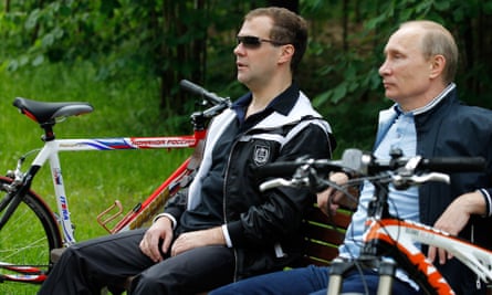 Medvedev and Vladimir Putin relax during a cycle ride in 2011