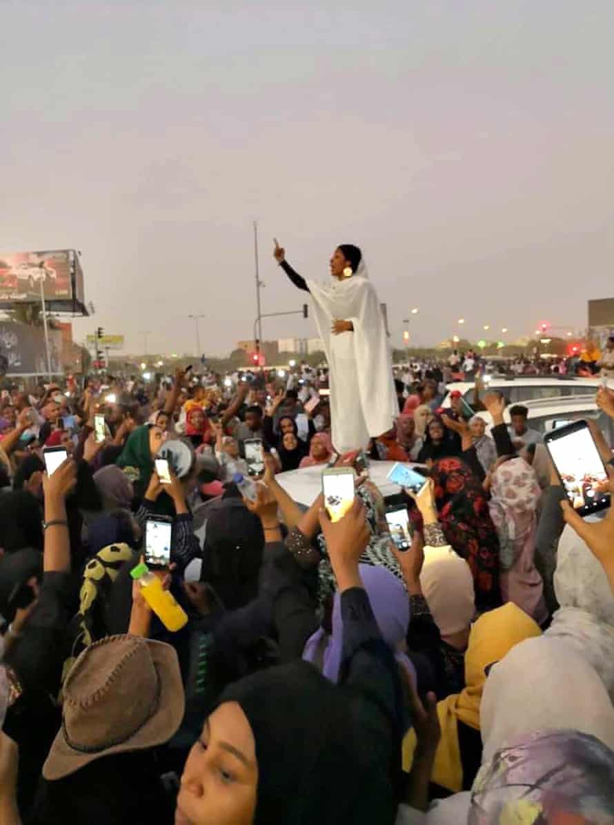 Viral image of Khartoum protester Alaa Salah addressing the crowd during the Sudan uprising in 2019