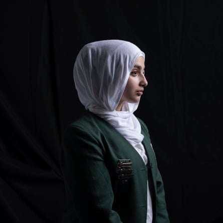 Nourhana, wearing a hijab and her Islamic College of Brisbane uniform, is seen in profile