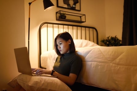 Woman working from her laptop at home late at nightPosed by model GettyImages-1150614537