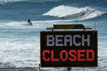 Lifeguards try to remove surfers in the water during the Easter weekend at Bronte Beach in Sydney.