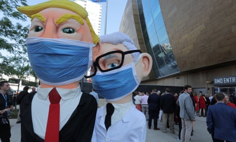 Demonstrators dressed as Trump and Anthony Fauci.