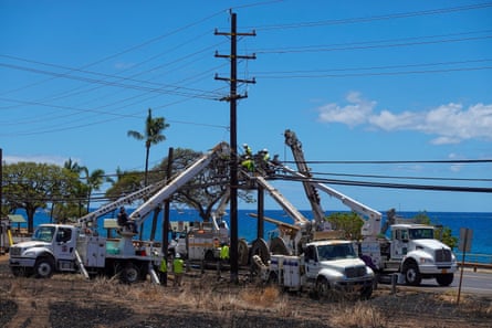 Workers repair utility lines in Lahaina.