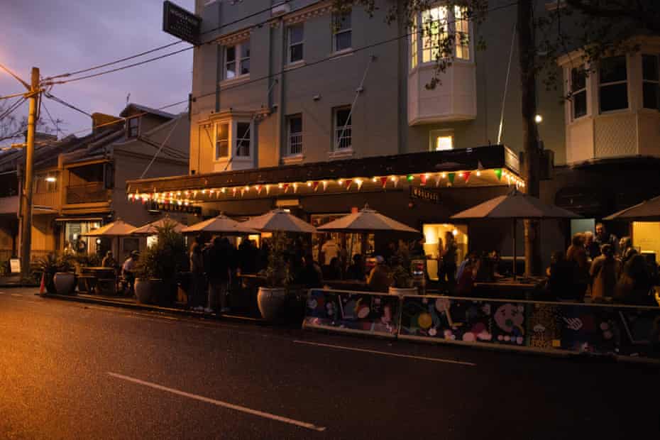 Patrons gather outside the Woolpack hotel in Redfern on Monday evening.