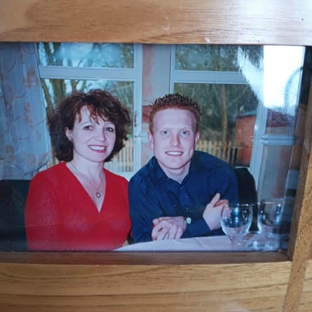 A photo of the pair at a dining table. They are smiling for the camera