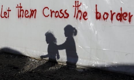 Shadows of children on a tent at the northern Greek border point of Idomeni.