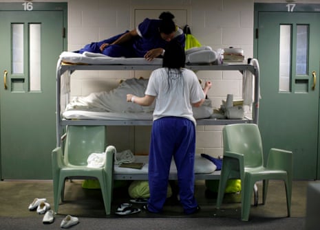 Women chat as they lie on beds placed in the communal area outside cells, due to overcrowding at the Los Angeles County Women's jail in Lynwood, California.