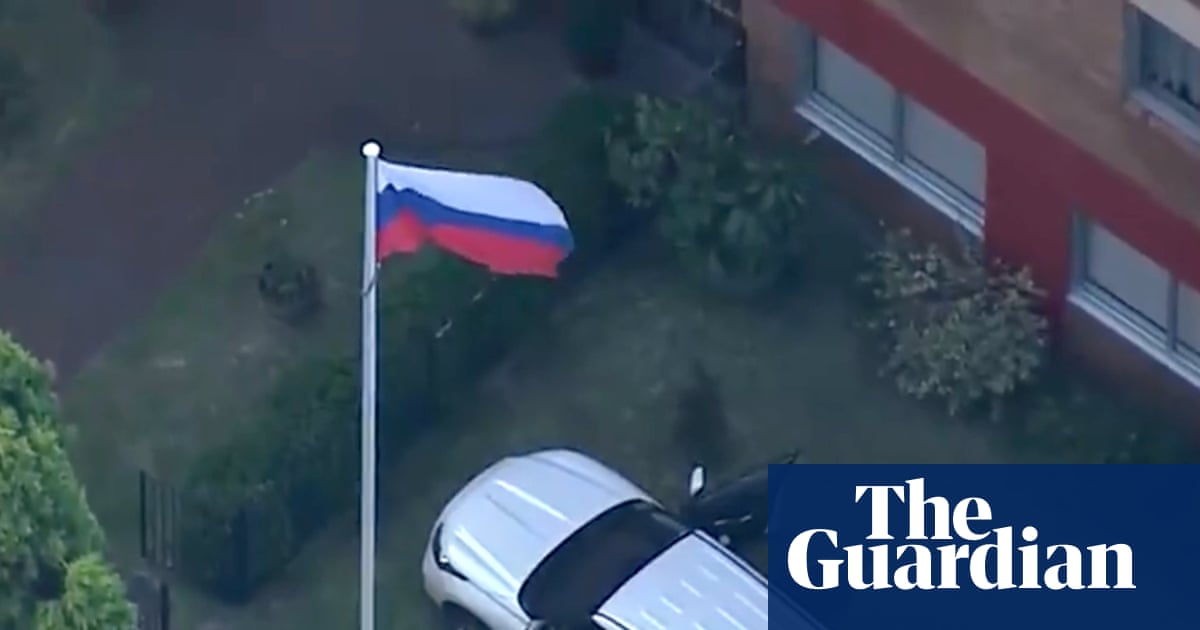 Man arrested after allegedly ramming car through front gates of Russian consulate in Sydney