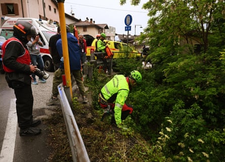 Rescue teams assist the rider Alessio Martinelli after an accident during the Giro d’Italia on Tuesday