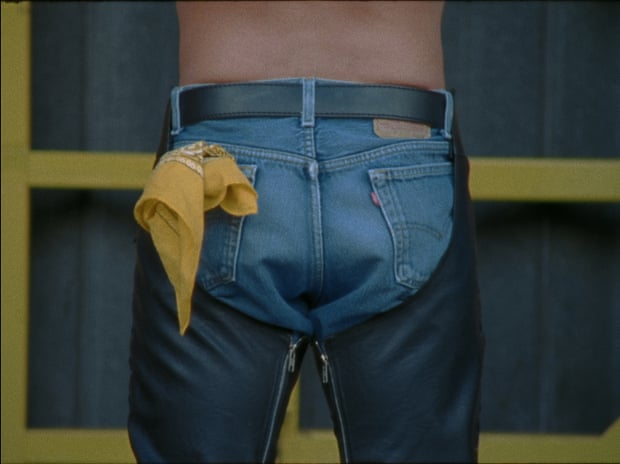 Man with a yellow handkerchief in back pocket