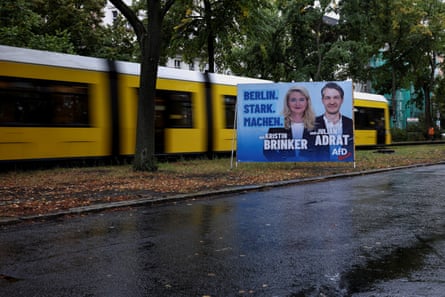 Poster featuring two candidates with train behind